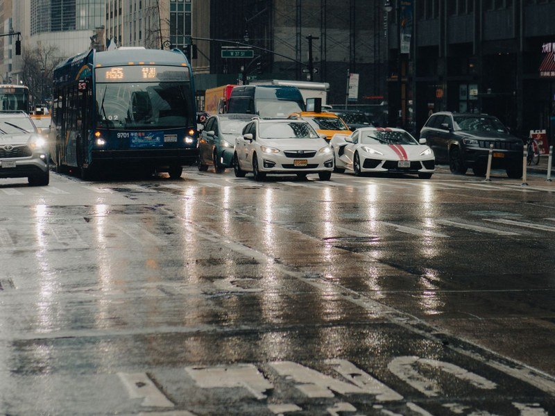 MTA city bus in traffic on a rainy New York street